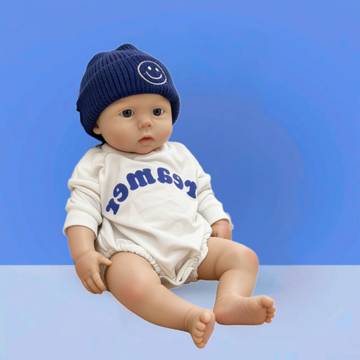 22Inch Cool & Calm Reborn Baby Doll Silas – Navy Smiley Knit Beanie & Minimalist White Onesie, Perfect Cuddle Partner