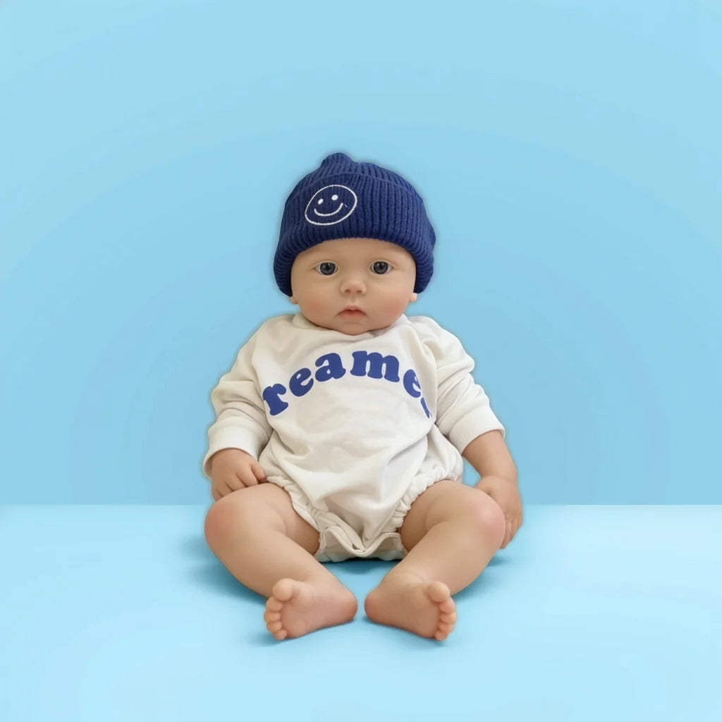 22Inch Cool & Calm Reborn Baby Doll Silas – Navy Smiley Knit Beanie & Minimalist White Onesie, Perfect Cuddle Partner